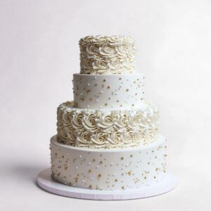 ALTERNATING WHITE PIPED ROSES WITH GOLD & WHITE DRAGEES 4 TIER